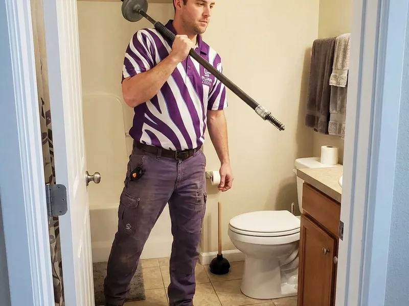 Professional plumber performing toilet repair spokane wa service